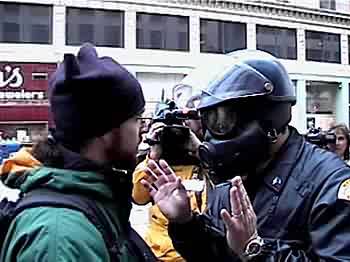 protester argues with police